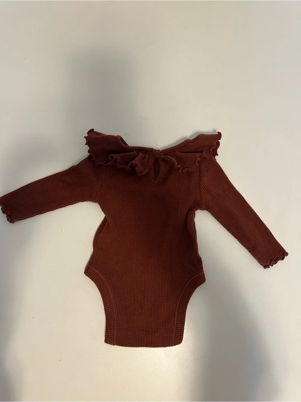 Rust Ruffle Neck Ribbed Baby Onesie